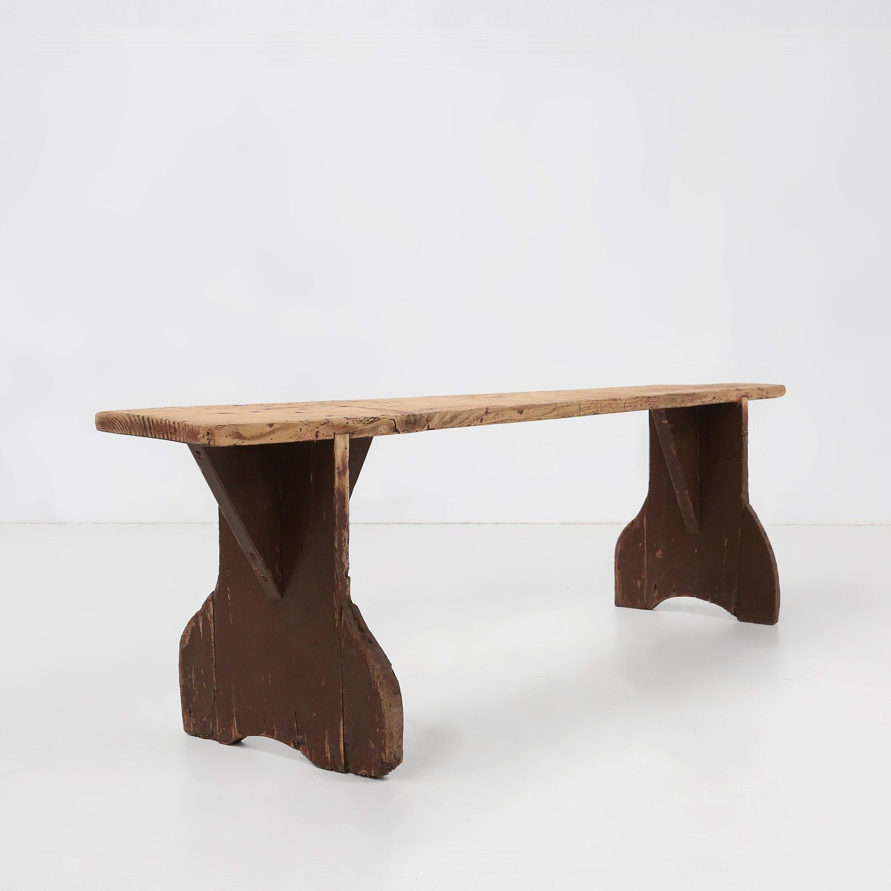 Rustic wooden bench in with brown painted feet, France ca. 1890-img